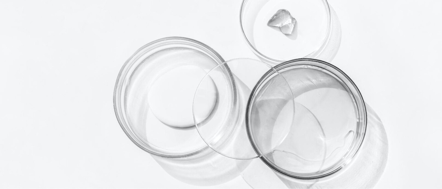 Glass skincare jars used as the homepage hero image on the Perfectus Beauty Arosha distributor website.