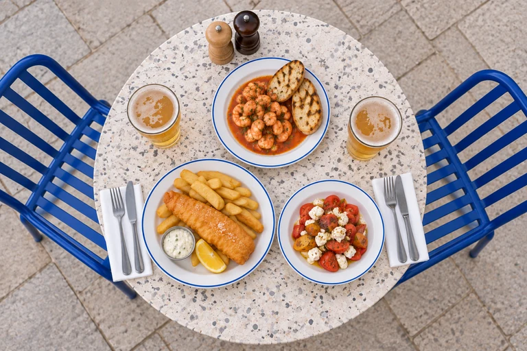 Overhead view of seafood and sharing plates